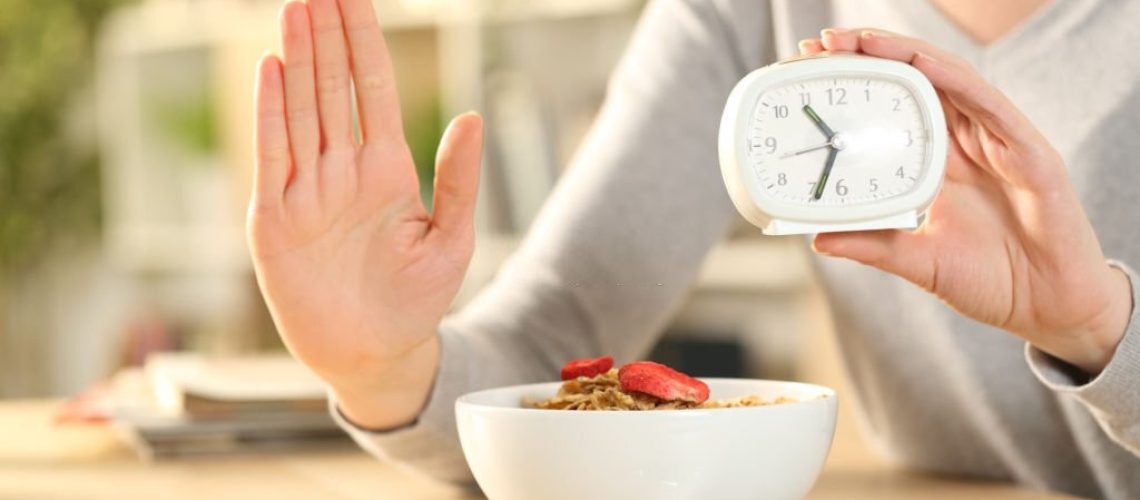 Woman hands on intermittent fasting doing stop sign