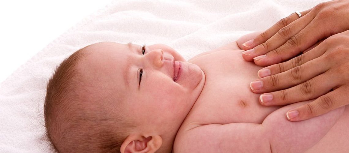 Newborn baby is enjoying massage from mother. Mixed german/japanese girl, about 12 weeks old.