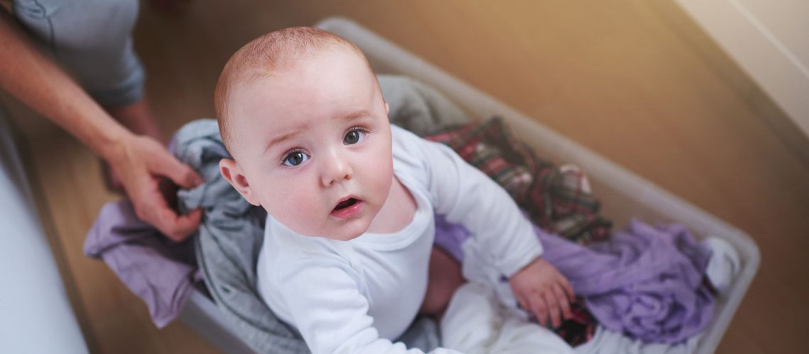 High angle portrait of a baby girl sitting in a laundry baskethttp://195.154.178.81/DATA/i_collage/pi/shoots/784147.jpg